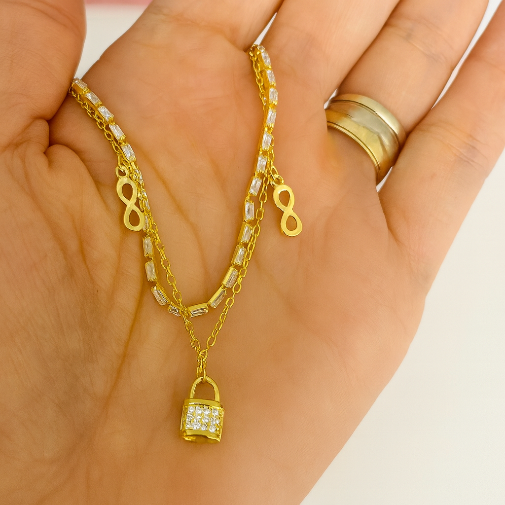 Brățară L’amour Scellé din argint 925 placată cu aur 14K, cu lacăt și simbol infinit. BD326